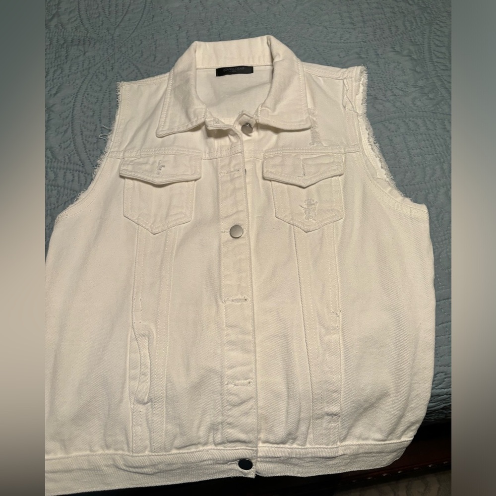 White sleeveless denim jacket